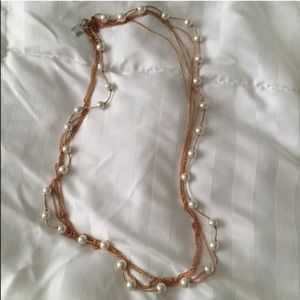 Long yellow tone pearl necklace